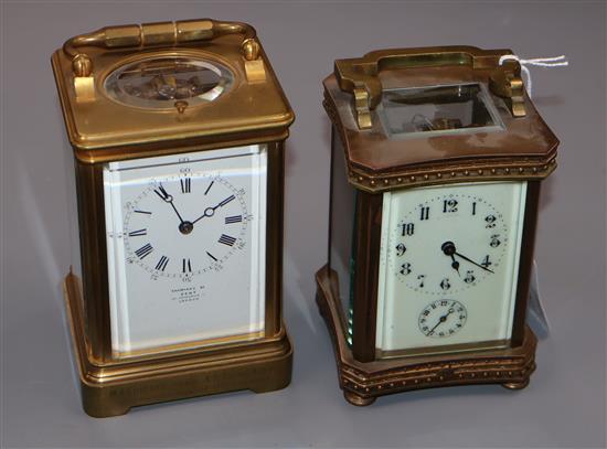An early 20th century brass repeating carriage clock, retailed by Dent and one other brass carriage timepiece.